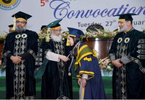 Graduate student receiving gold medal during the 5th convocation of ISRA University at Jinnah Convention Centre