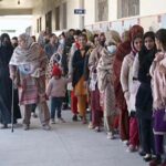 A large number of women standing in queue to cast their vote in the polling station during General Election-2024