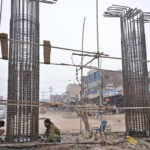 Labourers in work on flay over Qanchi Moor