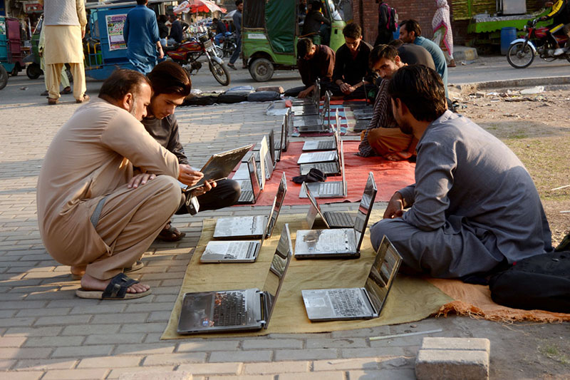 Vendors selling laptop at roadside setup in the Provincial Capital