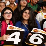 Spectators enjoy during the Pakistan Super League (PSL 9) Twenty20 cricket match between Karachi Kings and Islamabad United at the National Cricket Stadium