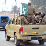 Security officials holding flag march in the city to develop a sense of protection among the masses and maintain law and order situation during the General Election 2024