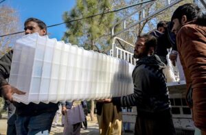 Polling staff on the way after receiving polling material at distribution Centre for General Elections 2024.