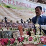 A person viewing the different stuff displayed by a vendor at Mohenjo-Daro