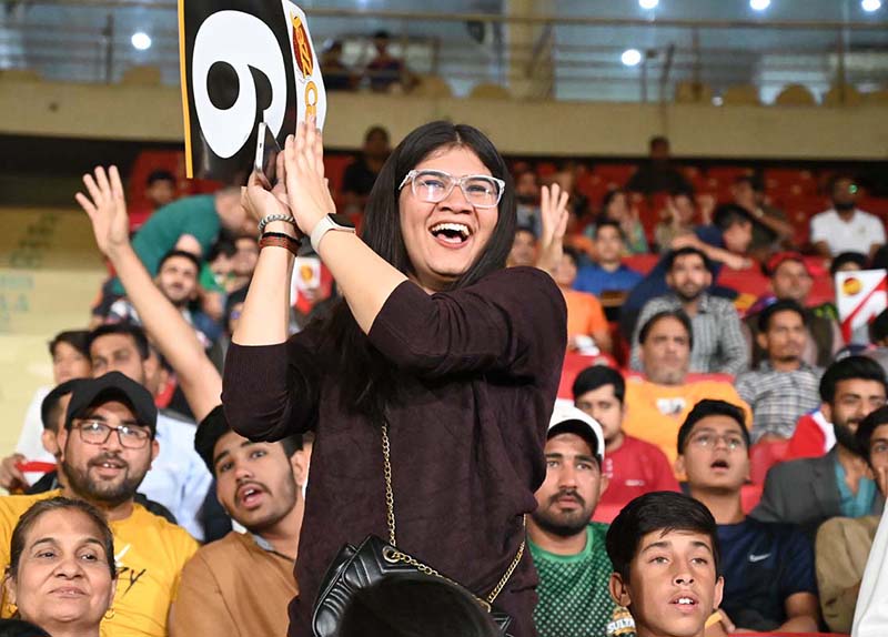 Spectators enjoy during the Pakistan Super League (PSL 9) Twenty20 cricket match between Karachi Kings and Islamabad United at the National Cricket Stadium