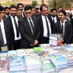 District and Session Judge Syed Sharafuddin Shah visiting Book stalls after inaugurating 3rd Law Books Festival 2024 at District Court, organized by District Bar Association