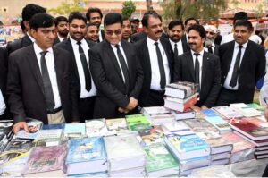 District and Session Judge Syed Sharafuddin Shah visiting Book stalls after inaugurating 3rd Law Books Festival 2024 at District Court, organized by District Bar Association