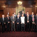 President Dr. Arif Alvi in a group photo with the recipients of recognition shields at the award distribution ceremony for the officers of the Federal Insurance Ombudsman and representatives of insurance companies, at Governor House