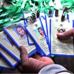 A worker displaying polling officials staff cards for General Election -2024 at DRO office