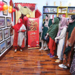 China Window official giving briefing visitors during celebration of Chinese New Year 2024 "Year of The Dragon" at China Window office