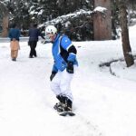 Tourist enjoying skating on the fresh snow at Nalter Valley