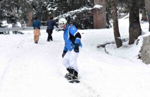 Tourist enjoying skating on the fresh snow at Nalter Valley