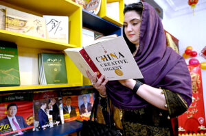 China Window official giving briefing visitors during celebration of Chinese New Year 2024 "Year of The Dragon" at China Window office
