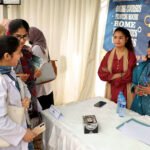 Participants visiting a stall during Job fair at Isra University