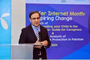 Caretaker Federal Minister for IT and Telecommunication, Dr. Umar Saif addressing launching ceremony of parental guide titled "Safeguarding Your Child in the Digital Age" at Telenor Headquarters