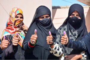 Women voters showing thumbs after casting their vote in polling station during General Election-2024