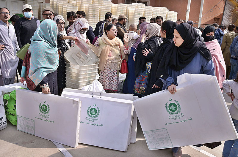 Polling staff receiving polling material at distribution Centre for General Elections 2024