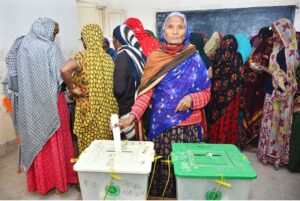 Women voters showing thumbs after casting their vote in polling station during General Election-2024