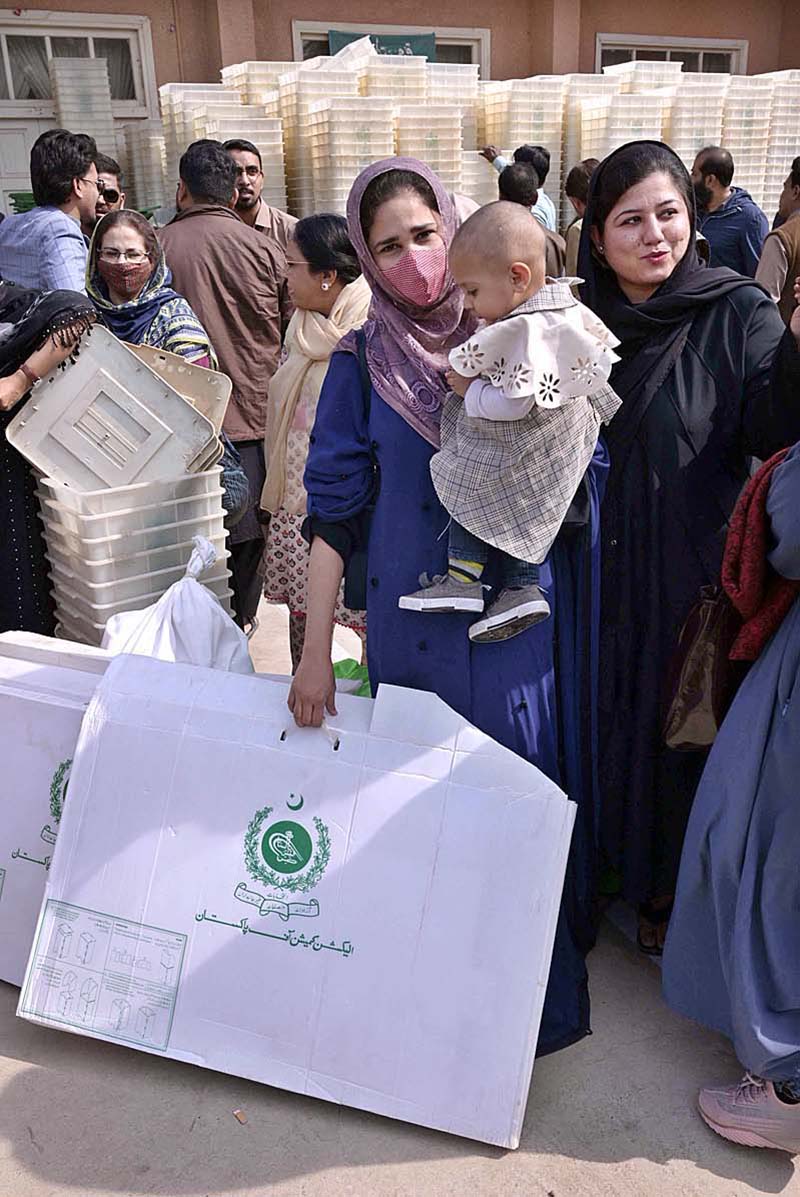 Polling staff receiving polling material at distribution Centre for General Elections 2024