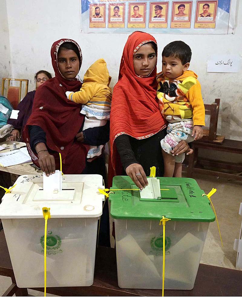Women voters showing thumbs after casting their vote in polling station during General Election-2024
