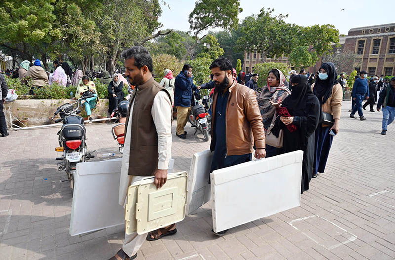 Polling staff receiving polling material at distribution Centre for General Elections 2024