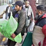 Polling staff on the way after receiving polling material at distribution Centre for General Elections 2024