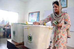 A female voter casting her vote in polling station during General Elections-2024