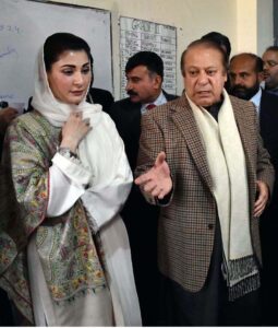 Former Prime Minister and PML-N leader Nawaz Sharif gives his thumb impression on a ballot paper to cast his vote at polling station during General Election-2024