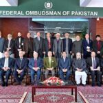President Dr. Arif Alvi in a group photo during his visit to the office of the Wafaqi Mohtasib