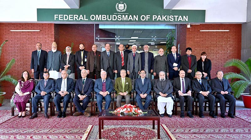 President Dr. Arif Alvi in a group photo during his visit to the office of the Wafaqi Mohtasib