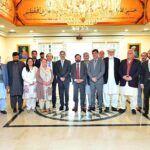 Caretaker Prime Minister Anwaar-ul-Haq Kakar in a group photo with the Chairman and members of Royal Foundation of Gilgit Baltistan