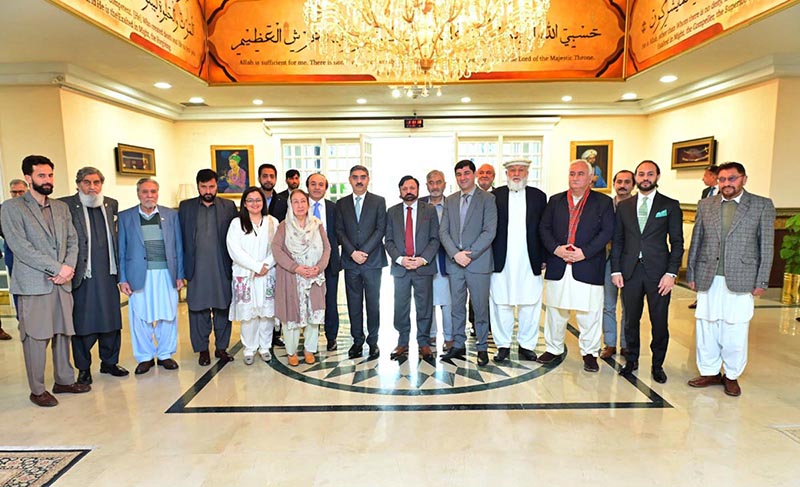 Caretaker Prime Minister Anwaar-ul-Haq Kakar in a group photo with the Chairman and members of Royal Foundation of Gilgit Baltistan