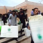 Presiding officers receiving ballot material on the eve of General Elections 2024 at Korangi Girls College.