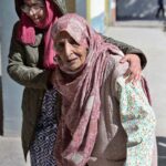 An elderly woman coming at polling station to cast her vote during General Election-2024