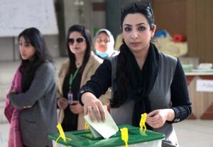 Women standing in queue waiting for their turn to cast their vote at polling station during General Election-2024.