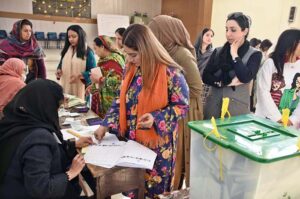 Women standing in queue waiting for their turn to cast their vote at polling station during General Election-2024.