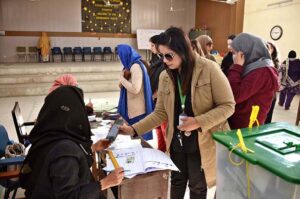 Women standing in queue waiting for their turn to cast their vote at polling station during General Election-2024.