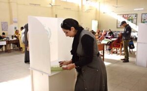 Women standing in queue waiting for their turn to cast their vote at polling station during General Election-2024.