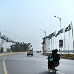Pakistan National flags installed on Rawal Chowk Flyover in celebration of Pakistan Day in the federal capital