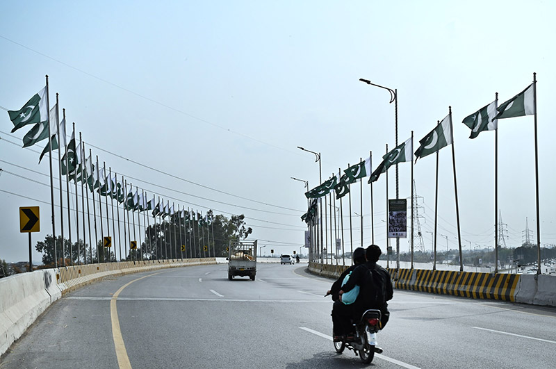 Pakistan National flags installed on Rawal Chowk Flyover in celebration of Pakistan Day in the federal capital