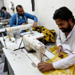 Tailors busy stitching clothes for upcoming Eid ul Fitr festival