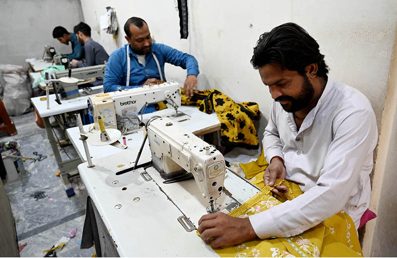 Tailors busy stitching clothes for upcoming Eid ul Fitr festival