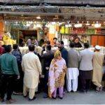 People purchasing food items in connection with upcoming Holy Fasting Month of Ramadan at Banni Chowk