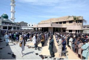 People perform the first Friday prayer at a mosque during the holy month of Ramadan at Saddar.