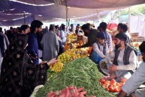 People arrive Ramadan Bazaar to purchase Fruits and Vegetables on subsidized rates near Shamsabad
