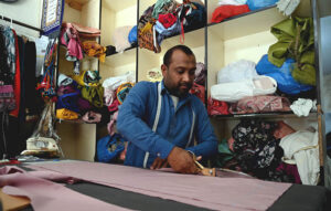 Tailors busy stitching clothes for upcoming Eid ul Fitr festival