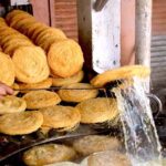 A vendor preparing traditional food item Pheoni in connection with upcoming Holy Fasting Month of Ramadan at Banni Chowk
