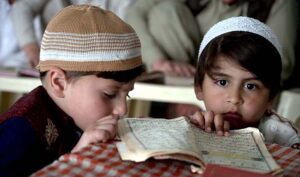 Madrassa Students reciting Holy Quran during Holy Fasting Month of Ramadan at Jamia Masjid Qazi Nizamuddin near Bani Chowk, This Historic Masjid under the administration of Hazrat Maulana Qari Syed Moinuddin Shah Sahib Established since 1966.