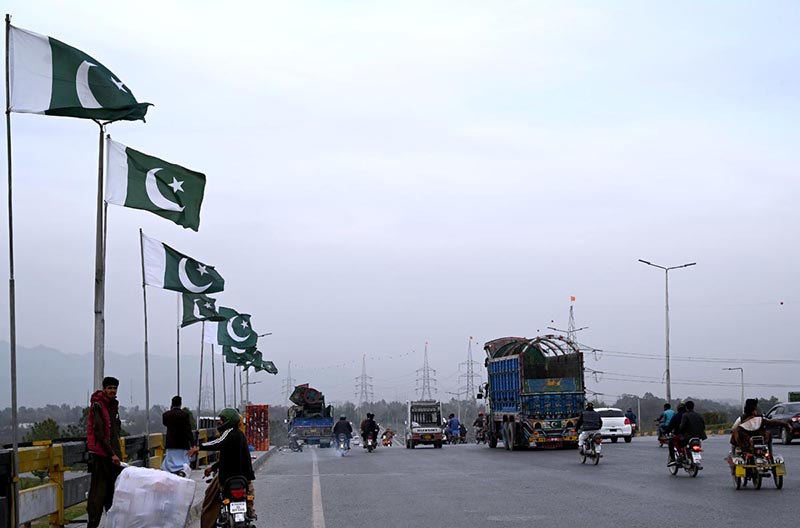 Pakistani flags installed on bridge in connection with Pakistan day in the Federal Capital.