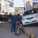 Traffic warden place the citizen’s car on the footpath for illegal parking at 6th Road